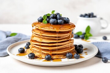 Wall Mural - stack of vegan pancakes with maple syrup and blueberries