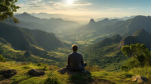 Man Sitting On A Hill Looking At View Of The Majestic Landscape At Daytime, Amazing Sunlight