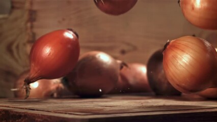 Poster - Onions fall on the table. Filmed on a high-speed camera at 1000 fps. High quality FullHD footage