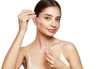 Wall Mural - beautiful elegant woman holding a cosmetic jar of oil serum or hyaluronic acid in her hand. perfect 