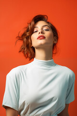 brunette woman model wearing white high neck top isolated on plain red studio background