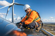 © Straxer - a worker in the maintenance of wind turbines in the mountains