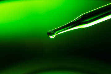 Wall Mural - macro green science experiment background,lab glassware filled with clear transparent liquids on ref