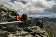 © Guzel - Man sitting on top on wooden bench and admiring the landscape, Austria