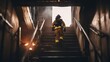Firefighter going up the stairs in burning building