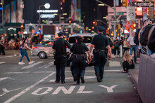 Police Patrol Time Square At Night