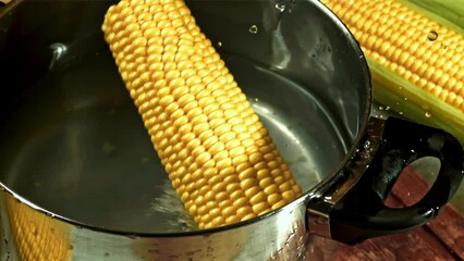 Sticker - Corn falls into the pan with splashes. Filmed on a high-speed camera at 1000 fps. High quality FullHD footage