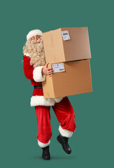 Sticker - Santa Claus carrying parcels on green background