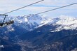 Elevated view of Susa Valley and snowy mountain peaks in Piedmont, Turin, Northern Italy. Located between the Graian Alps and the Cottian Alps. Taken from Sauze D'Oulx ski resort
