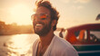 happy man with sunglasses and beard smiling and having fun on vacation by the sea in Italy