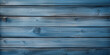 Textura de unos tablones de madera pintados de color azul, desgastados