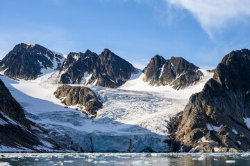 Glacier flowing into Hamilton Bay on a sunny summer day, Rand Fjord, Svalbard, Arctic
