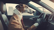 a dog in clothes is driving a car humor joke