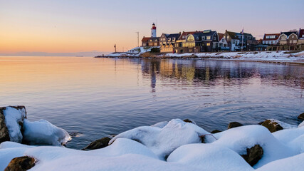 Wall Mural - Lighthouse of Urk Netherlands during winter with snow in the Netherlands.