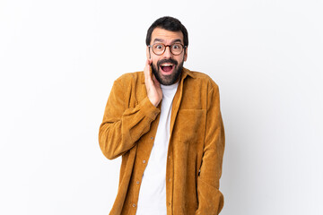 Sticker - Caucasian handsome man with beard wearing a corduroy jacket over isolated white background with surprise and shocked facial expression