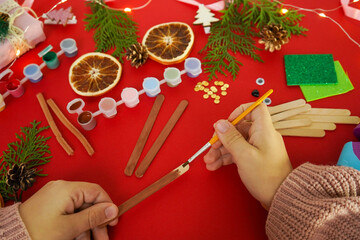 Wall Mural - Step by step instruction how to make christmas deer from ice cream sticks. Step 2 painting sticks brown. Children's New year handmade craft