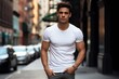 © JAYDESIGNZ - Male Latin model in a classic white cotton T-shirt and on a city street