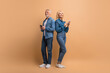 © Prostock-studio - Senior couple use modern smartphones, reading text messages