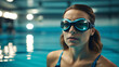 A woman wearing goggles in swimming pool.