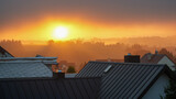 Fototapeta Na ścianę - Sunrise over the roofs of the town