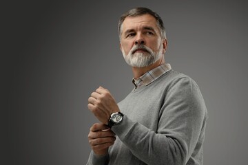 Sticker - Portrait of happy casual mature man smiling, senior age man with gray hair, Isolated on dark gray background