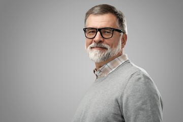 Sticker - Portrait of happy casual mature man smiling, senior age man with gray hair, Isolated on gray background