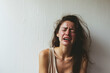 young woman crying: Tears, Grief, and the Pain of Emotional Distress