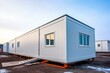 Newly constructed mobile industrial building with single storey prefabricated office container at construction site. Generative AI