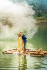 view of fishermen fishing on river in Thung mountain in Tra Linh, Cao Bang province, Vietnam with lake, cloudy, nature