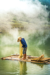 Wall Mural - view of fishermen fishing on river in Thung mountain in Tra Linh, Cao Bang province, Vietnam with lake, cloudy, nature