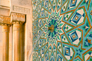 Wall Mural - Hassan II Mosque fountain made of mosaic tile work , Detail of Hassan II Mosque at sunset in Casablanca, Morocco