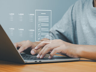 Wall Mural - online questionnaire or online survey, businessman selecting correct answer in questionnaire interne