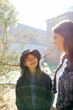 © Austockphoto - Aboriginal teacher talking to her female student outside in the school playground