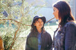 © Austockphoto - Aboriginal teacher talking to her female student outside in the school playground