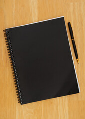 Wall Mural - Black journal notepad with pen background