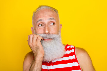 Poster - Photo of excited nervous elderly guy dressed striped red swimsuit biting fingers looking empty space isolated yellow color background