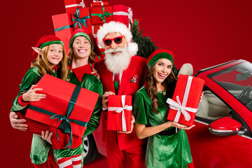 Poster - Funny four people costume theme x-mas party preparation concept hold presents isolated white color background