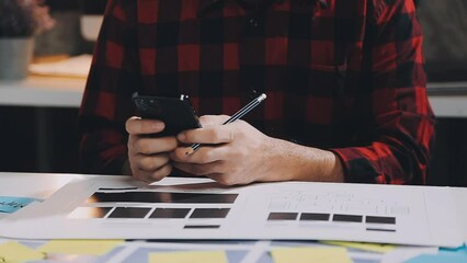 UX graphic designer planning application process development prototype wireframe for web smart phone. Creative digital development agency. in office