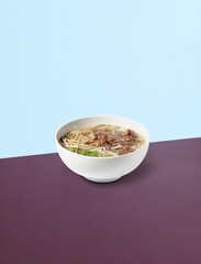 Photo of PHO soup on the background. The perfect picture for a poster. Modern food concept. Advertising for a restaurant. The image is fully sharp, front to back.