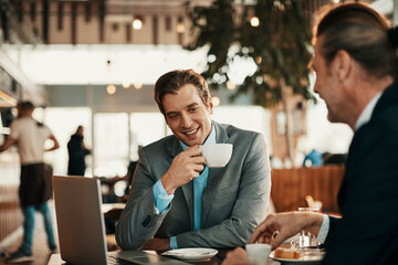 Wall Mural - Business partners talking in a coffee shop