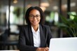 © pham - A Woman Working at a Desk With a Laptop Computer