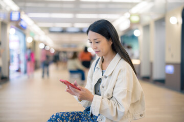 Wall Mural - Woman use of mobile phone at shopping mall