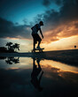 © THINGDSGN - man ride with skateboard during his vacation on the coast, enjoy the moment, sunset sky background and dramatic clouds in water reflection