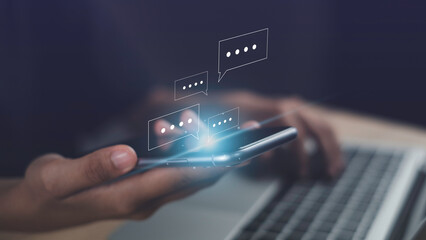 Live chat chatting on application communication concept. Hand using smartphone online typing chat with friend or service help show social media message chat box icon.