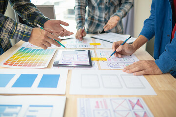 Wall Mural - the designer team is designing the uxui system to make the uxui system work well on new phones and s