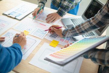 Wall Mural - the designer team is designing the uxui system to make the uxui system work well on new phones and s