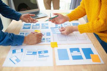 Wall Mural - the designer team is designing the uxui system to make the uxui system work well on new phones and s