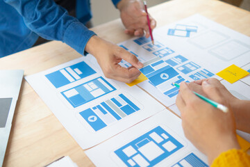 Wall Mural - the designer team is designing the uxui system to make the uxui system work well on new phones and s