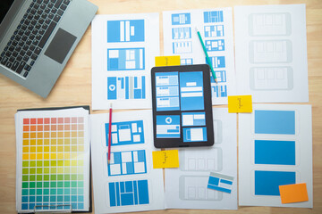Wall Mural - the designer team is designing the uxui system to make the uxui system work well on new phones and s