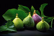 Ripe appetizing figs with green leaves